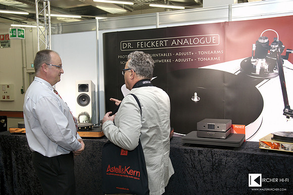 Dr. Chris Feickert at his booth with visitor