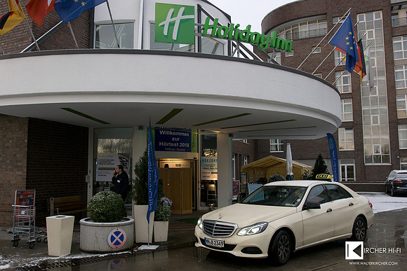 Holiday Inn main entry - 2018 with Welcome posters inviting to our showroom
